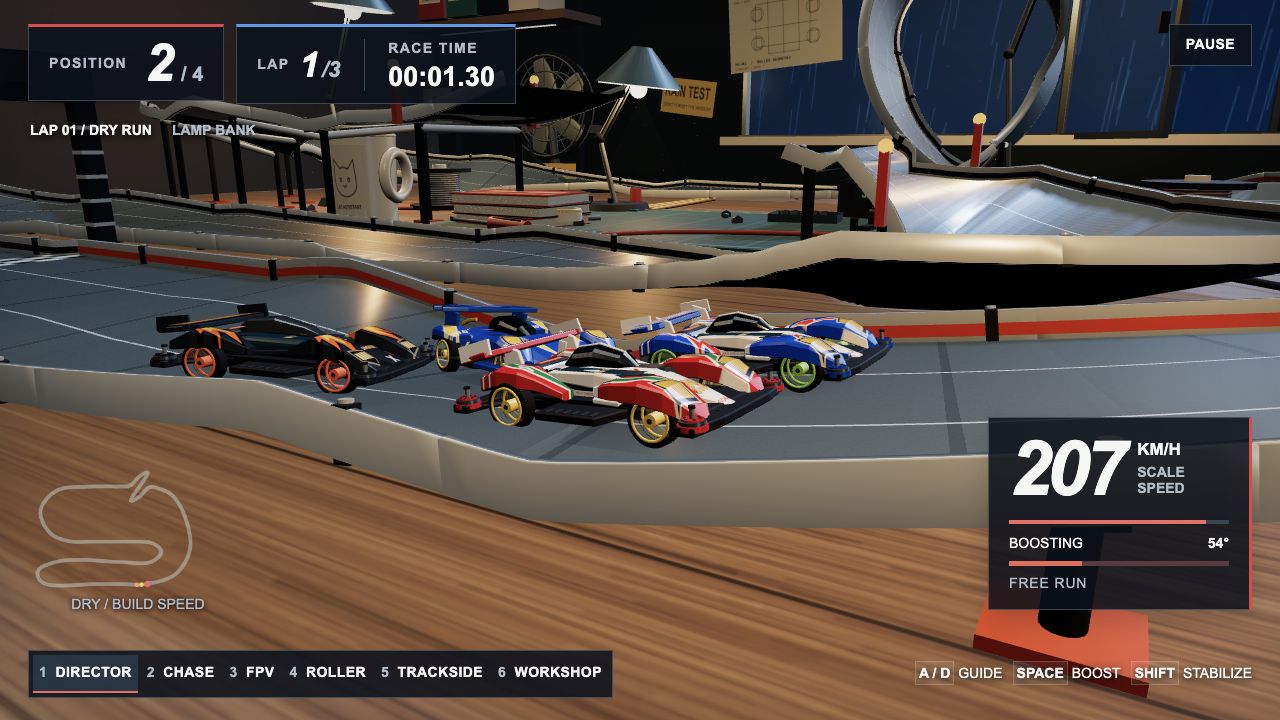 Four cars racing through the workshop
